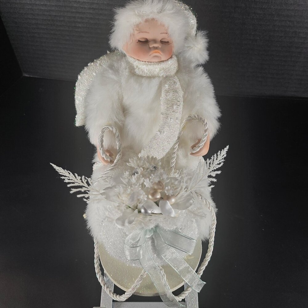 All White Heritage Signature Collection Porcelain Baby Doll in Winter Sleigh